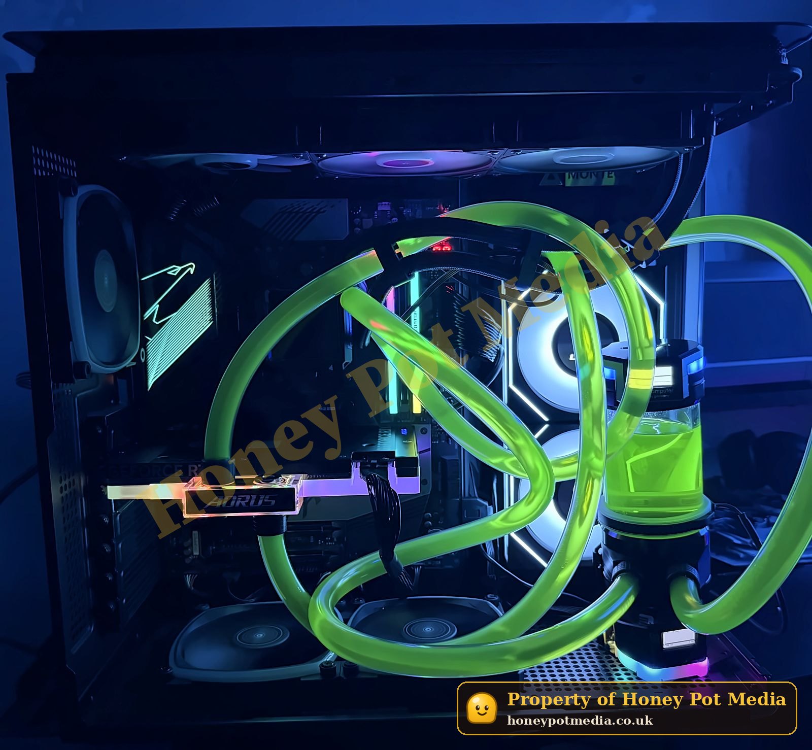 Custom water-cooled PC in a dark room, with neon green coolant running through loops of tubing, a cylindrical reservoir and an AORUS graphics card, lit by RGB fans.